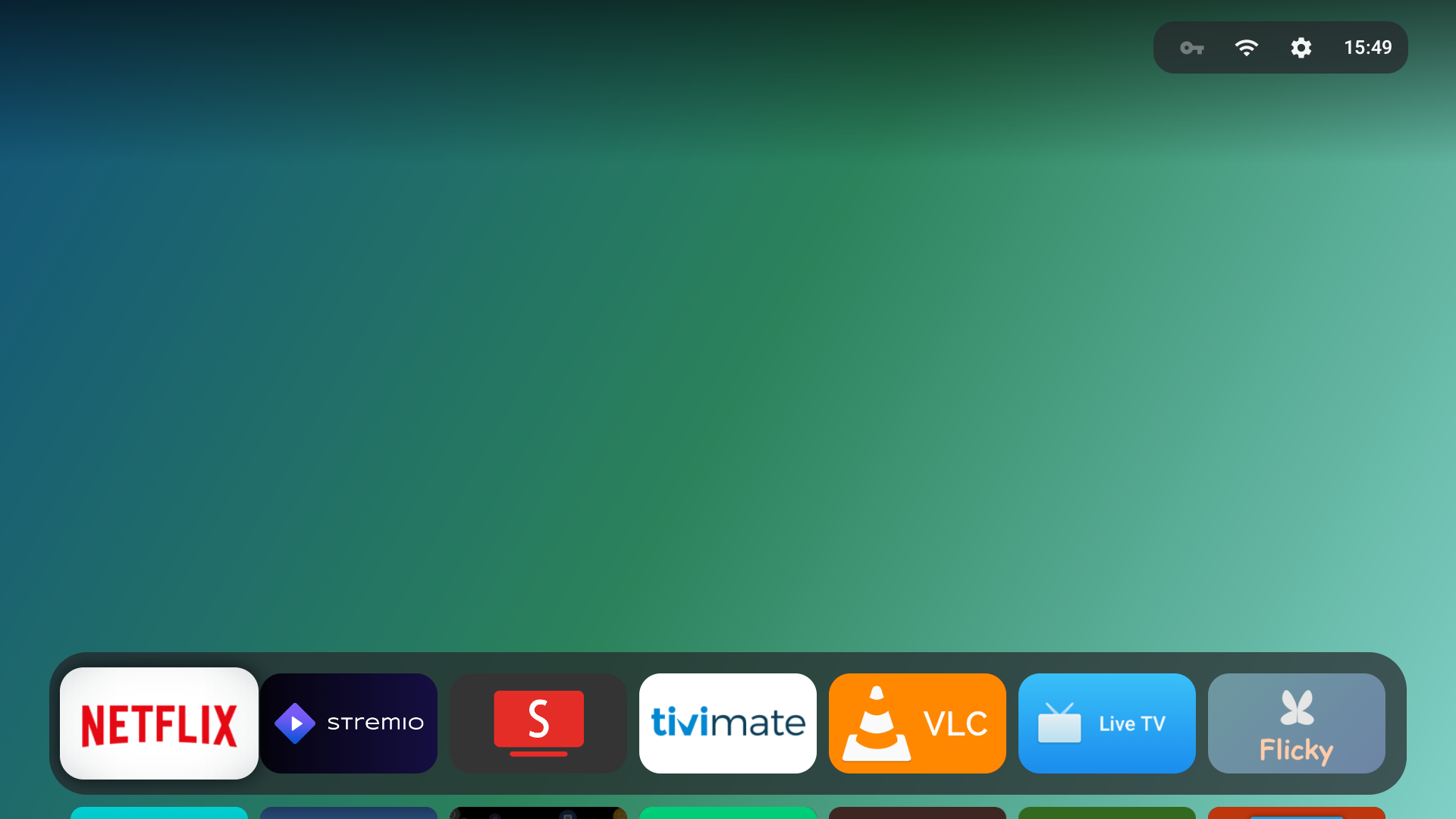 Couchy's floating glass Dock layout over a blue-sky gradient wallpaper, with app tiles for Netflix, Stremio and more